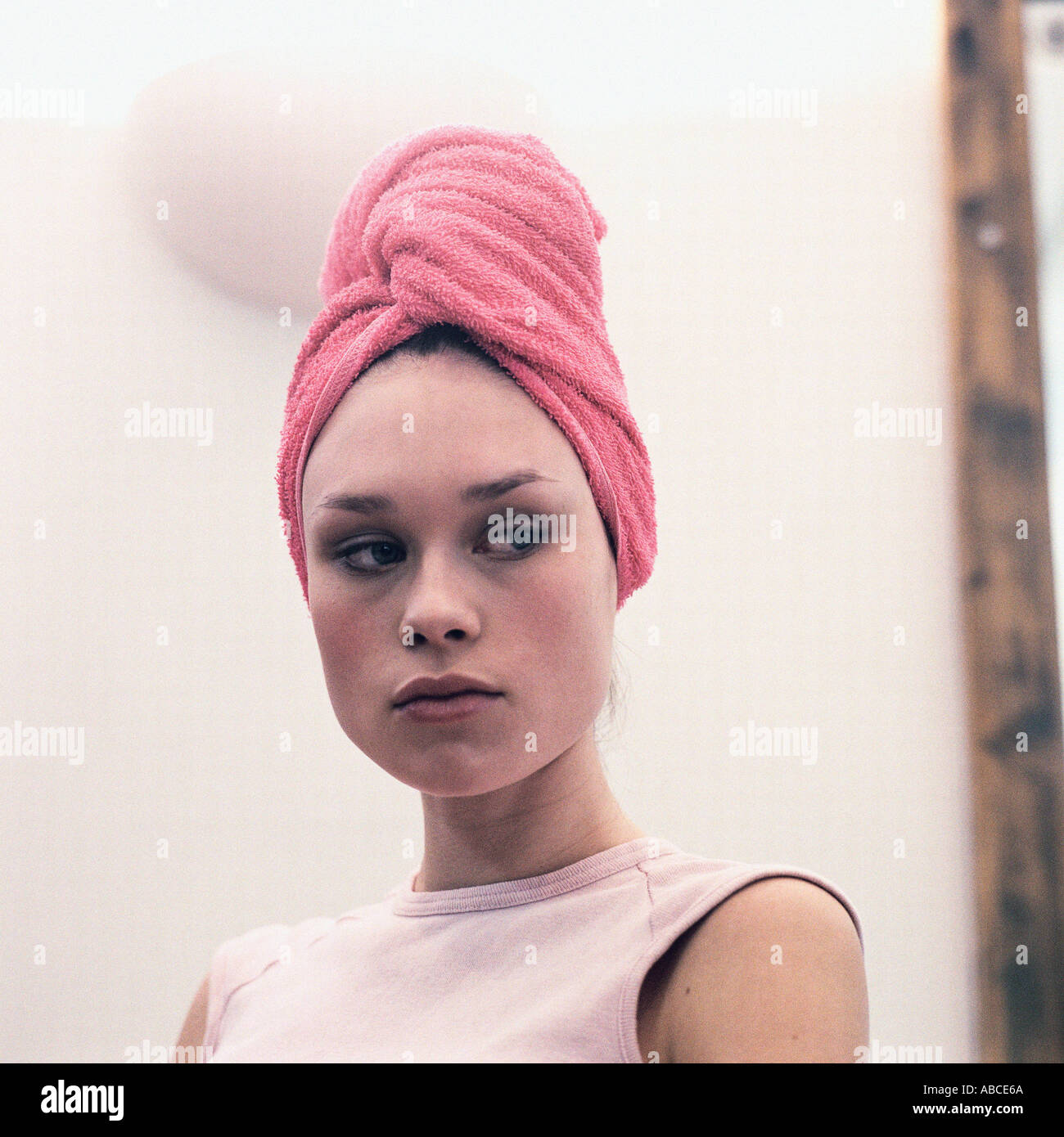 Woman with towel on head Stock Photo