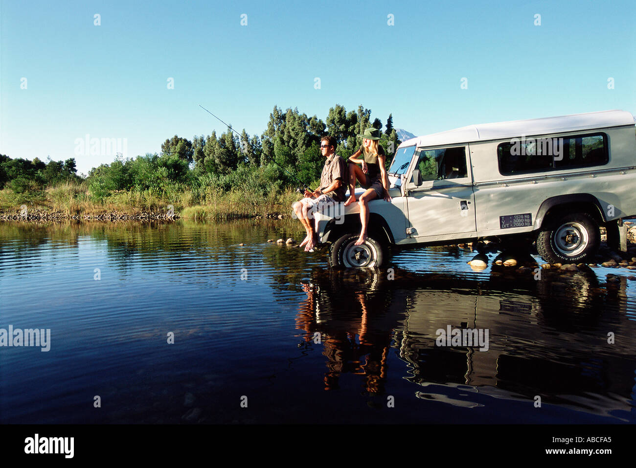 Couple fishing on a safari Stock Photo