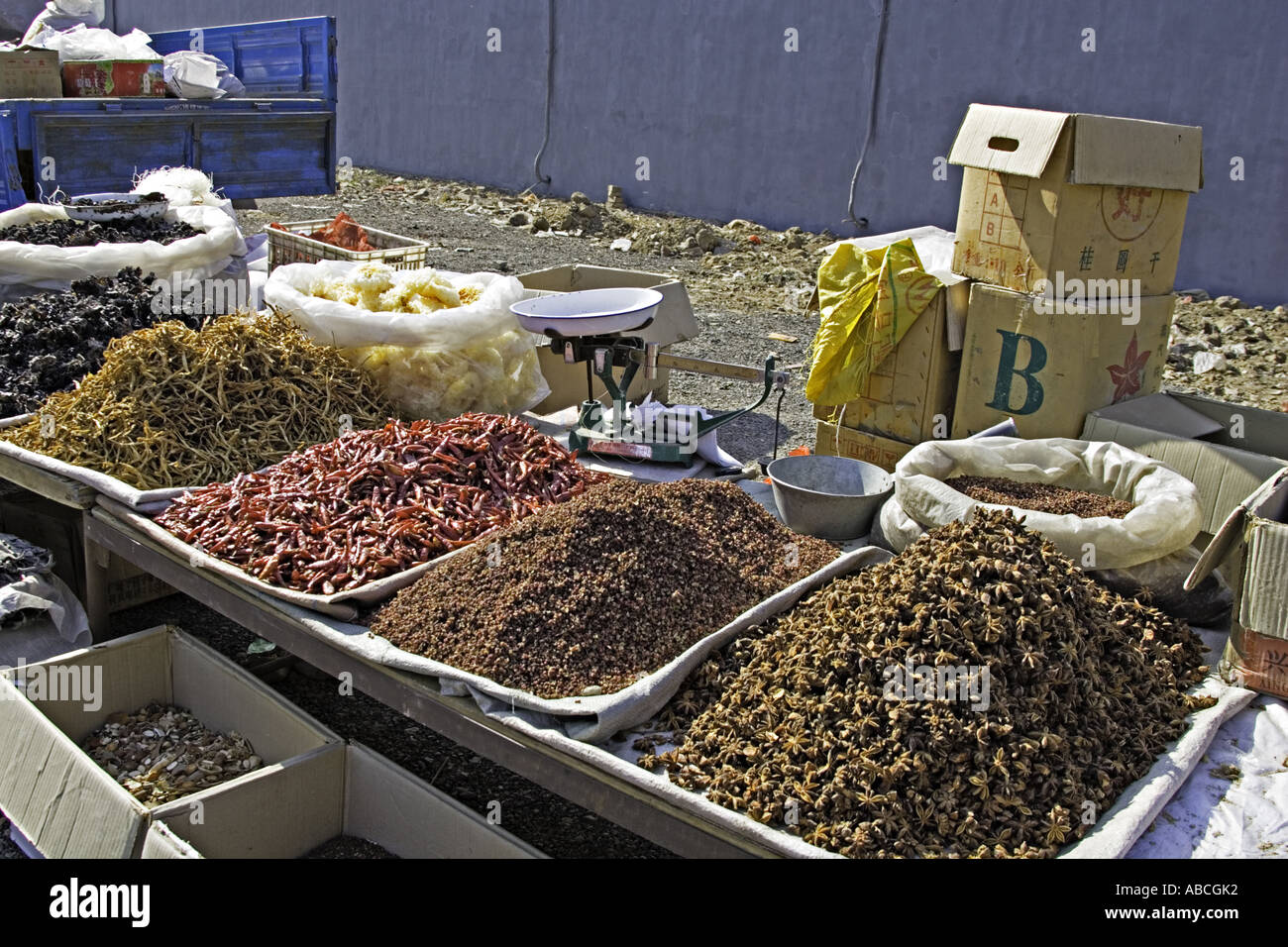 CHINA Beijing Wide variety of spices and dried food including star anise and chili peppers displayed for sale in open air market Stock Photo