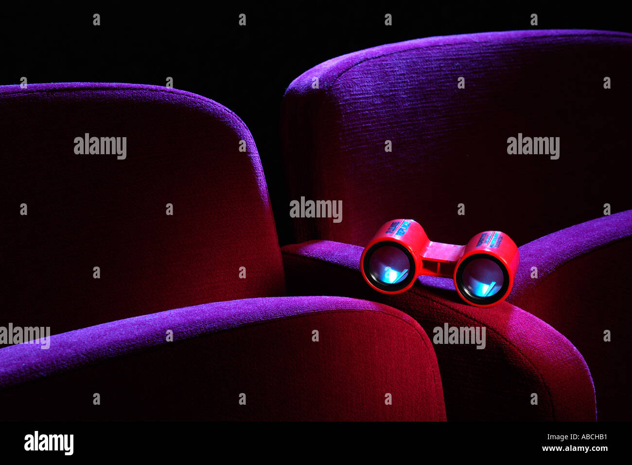 Opera glasses on a theatre seat Stock Photo