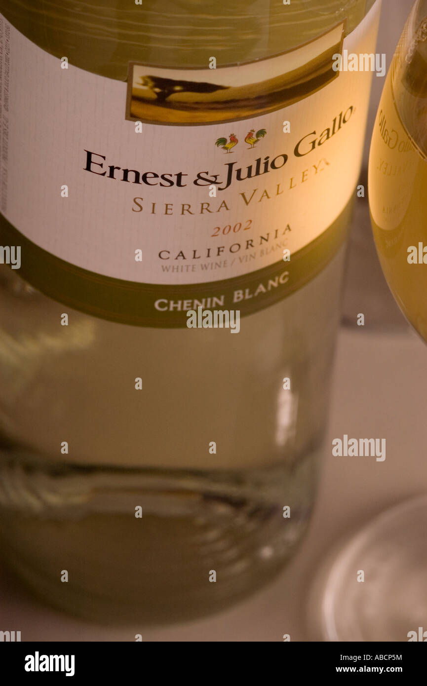 white wine and glasses around the bottle Stock Photo