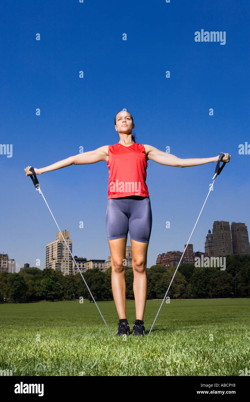 Woman using resistance bands Stock Photo