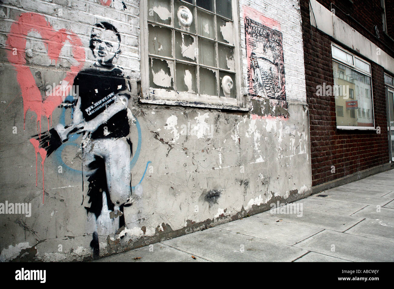 Banksy stencil of boy painting heart, Islington, London Stock Photo