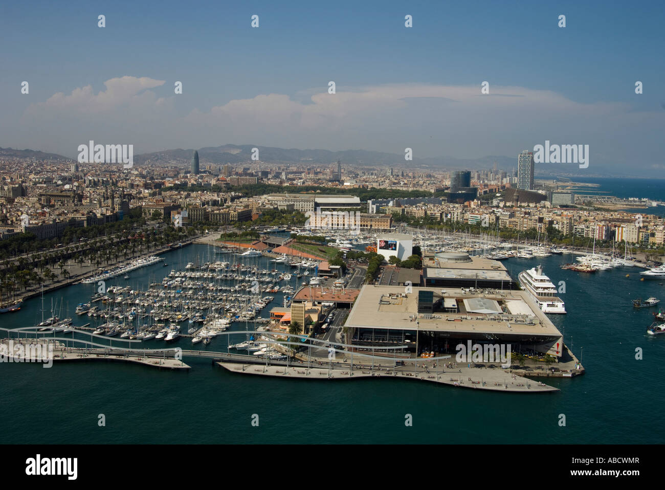Spain. Barcelona. View of downtown area, the yacht harbor and entertainment area, Mare Nostrum,  in front on right. Stock Photo