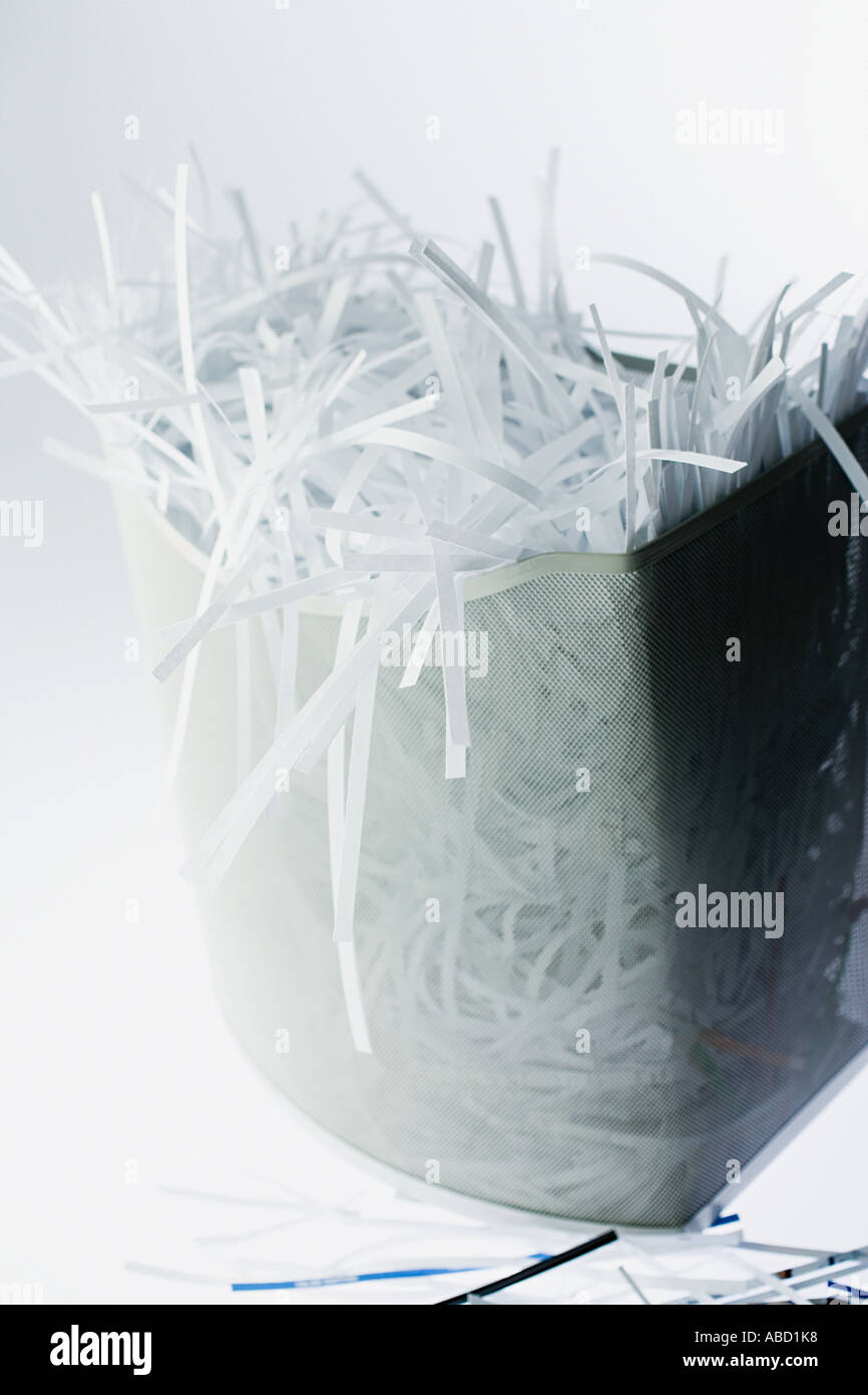 Shredded paper spilling out of bin Stock Photo Alamy