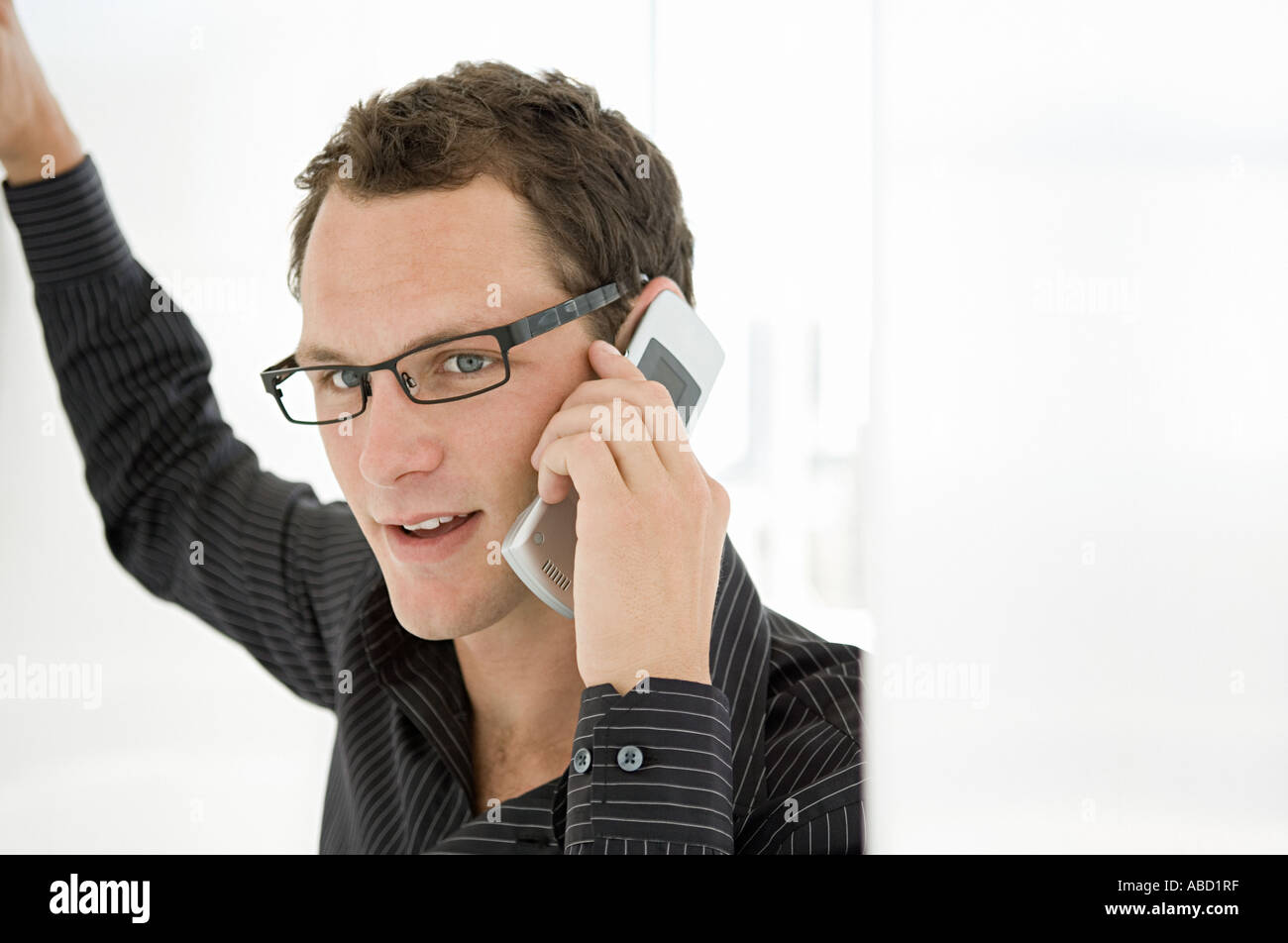 Businessman using cellular phone Stock Photo