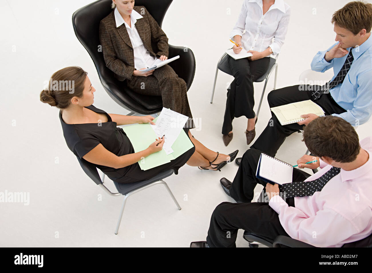 Five office workers in a meeting Stock Photo