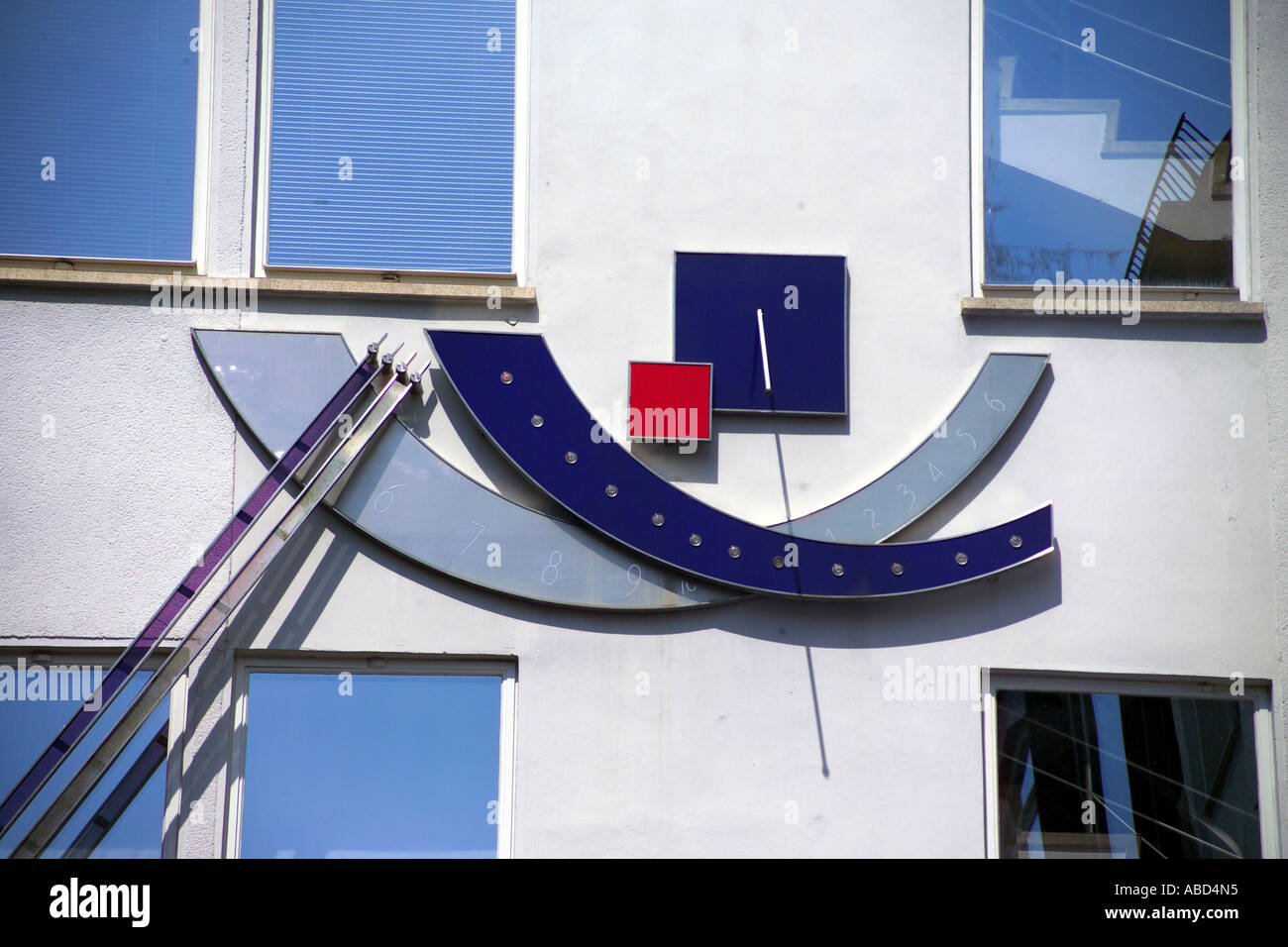 Modern sundial on a building Stock Photo