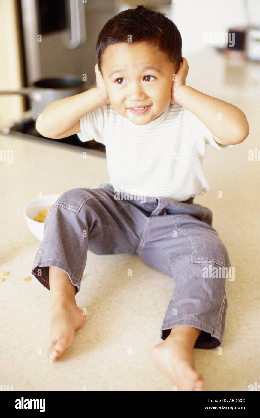 Child with hands over ears hires stock photography and images Alamy
