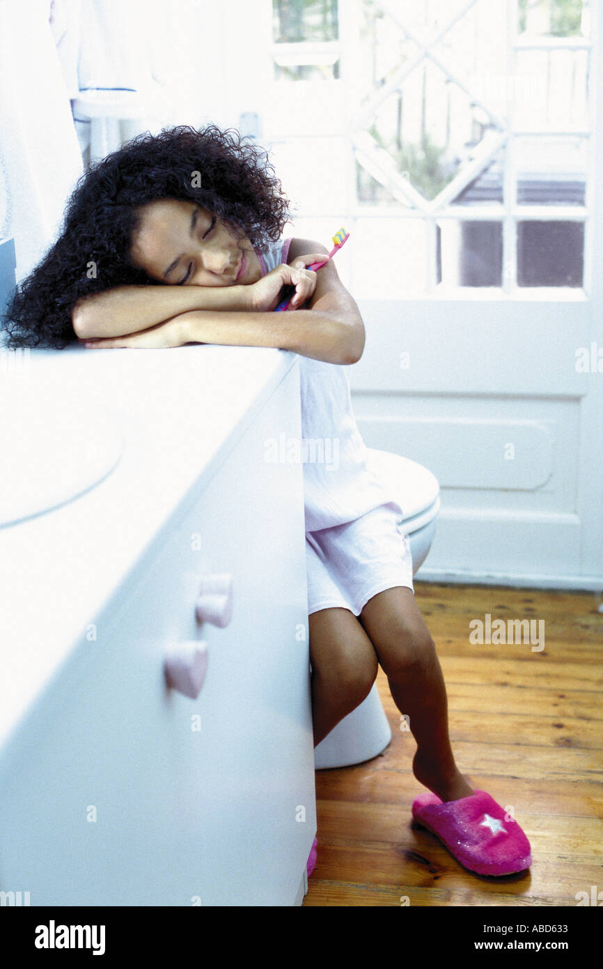 Girl sleeping in bathroom Stock Photo Alamy