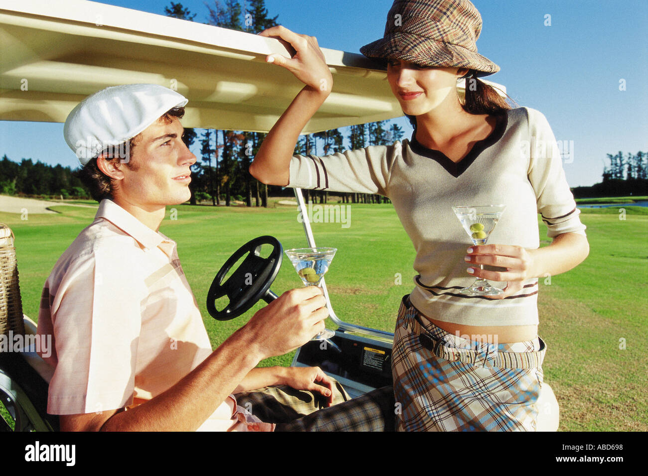 Man and woman playing golf Stock Photo