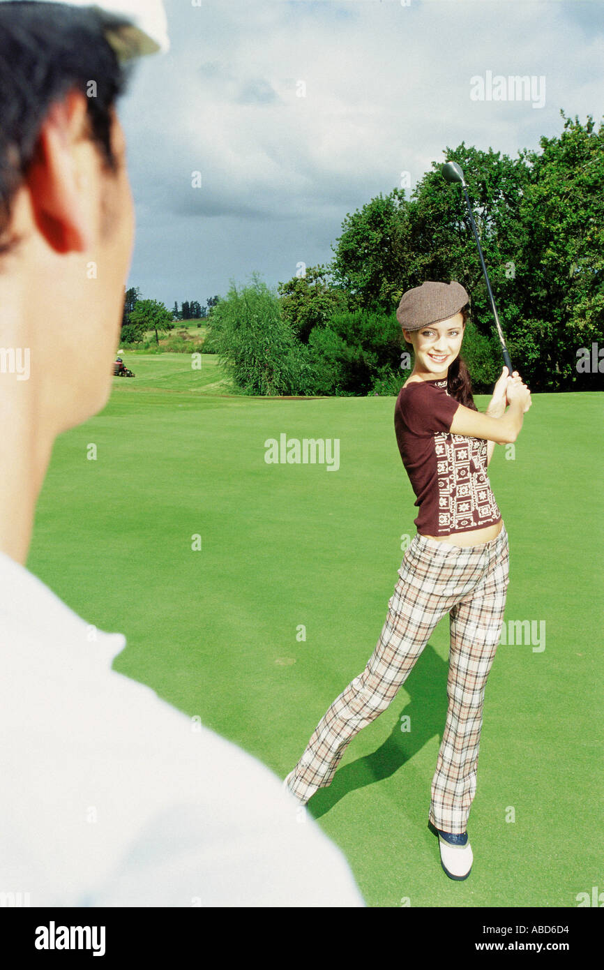 Man and woman playing golf Stock Photo