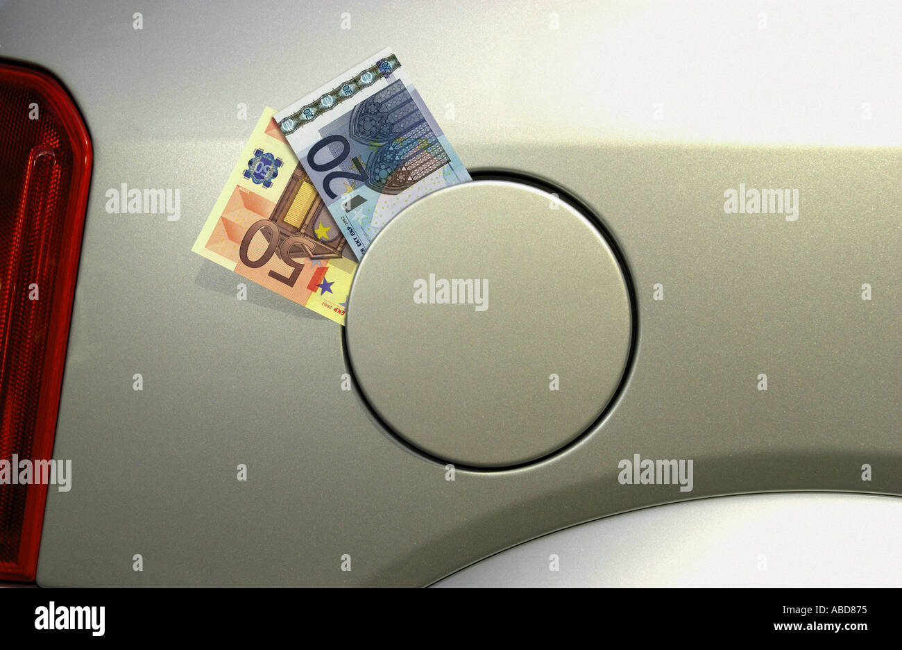 Euro in car fuel cap Stock Photo Alamy