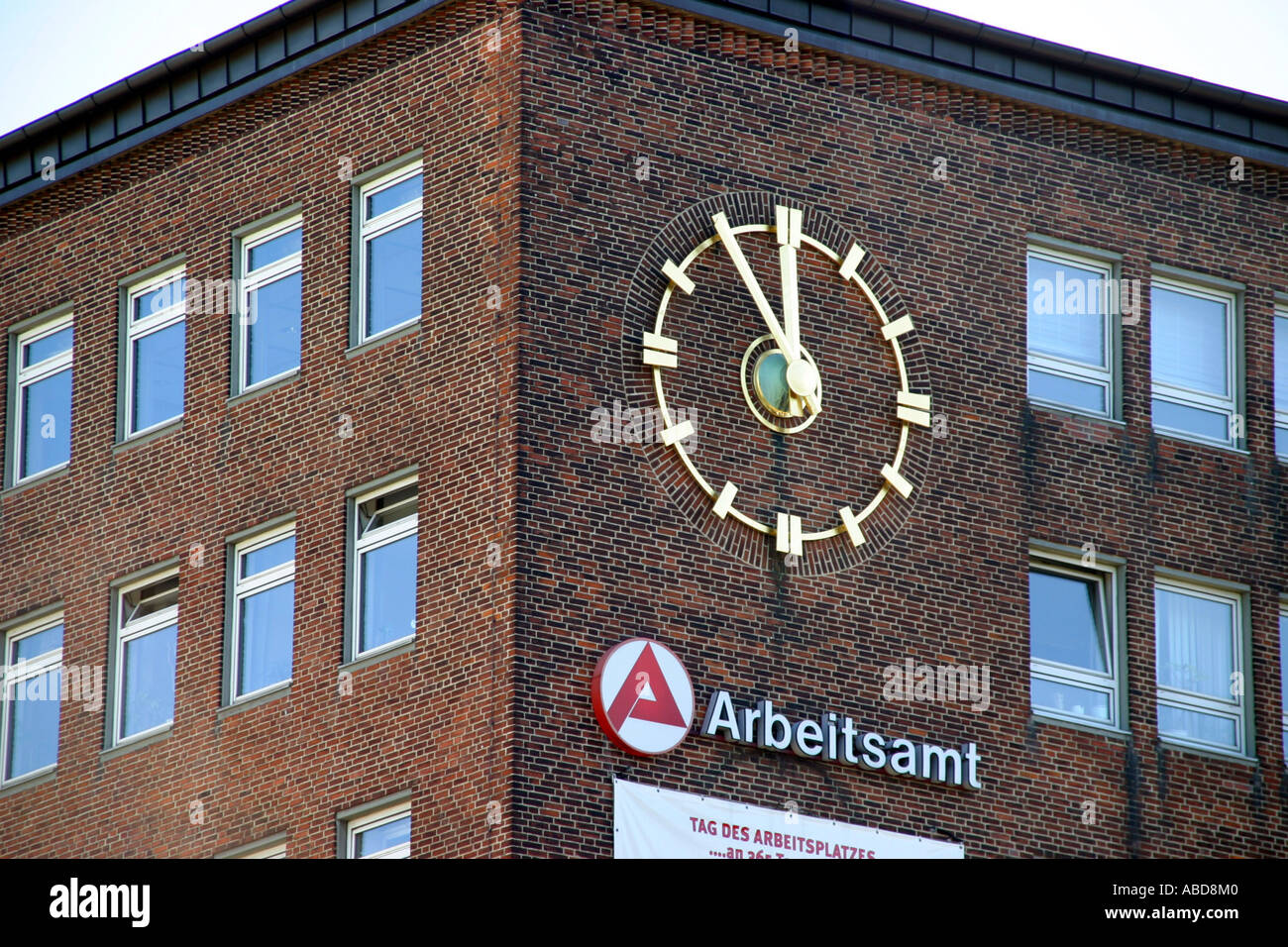 Labour office with clock 5 minutes before 12 Stock Photo