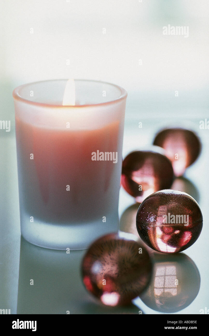 Candle with bath pearls Stock Photo Alamy