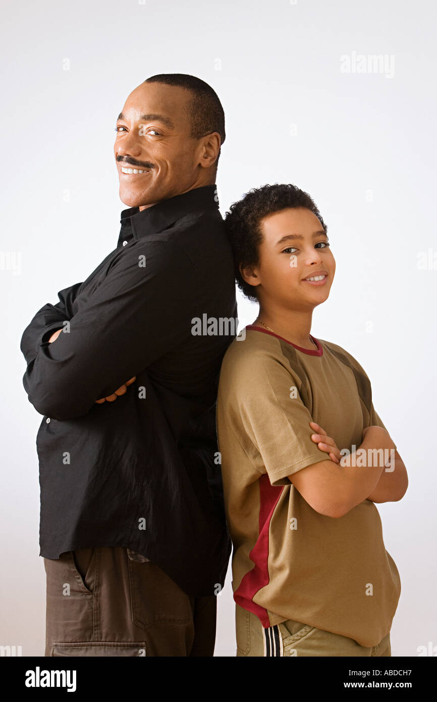 Father and son back to back Stock Photo Alamy