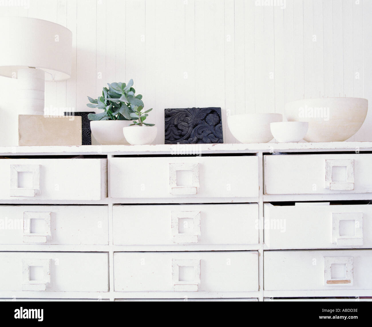 A white chest of drawers. Stock Photo