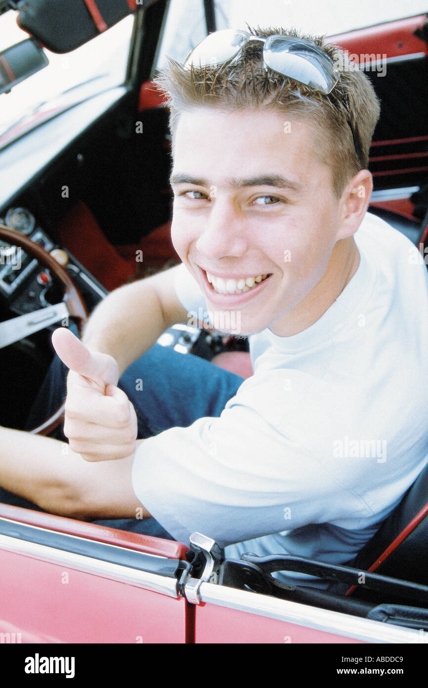 Young man in sports car Stock Photo Alamy