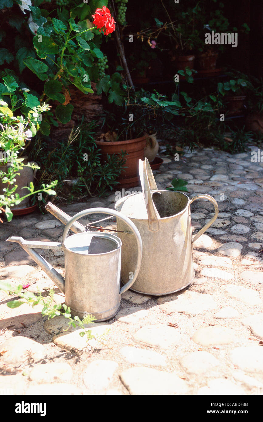 Two metal watering cans Stock Photo