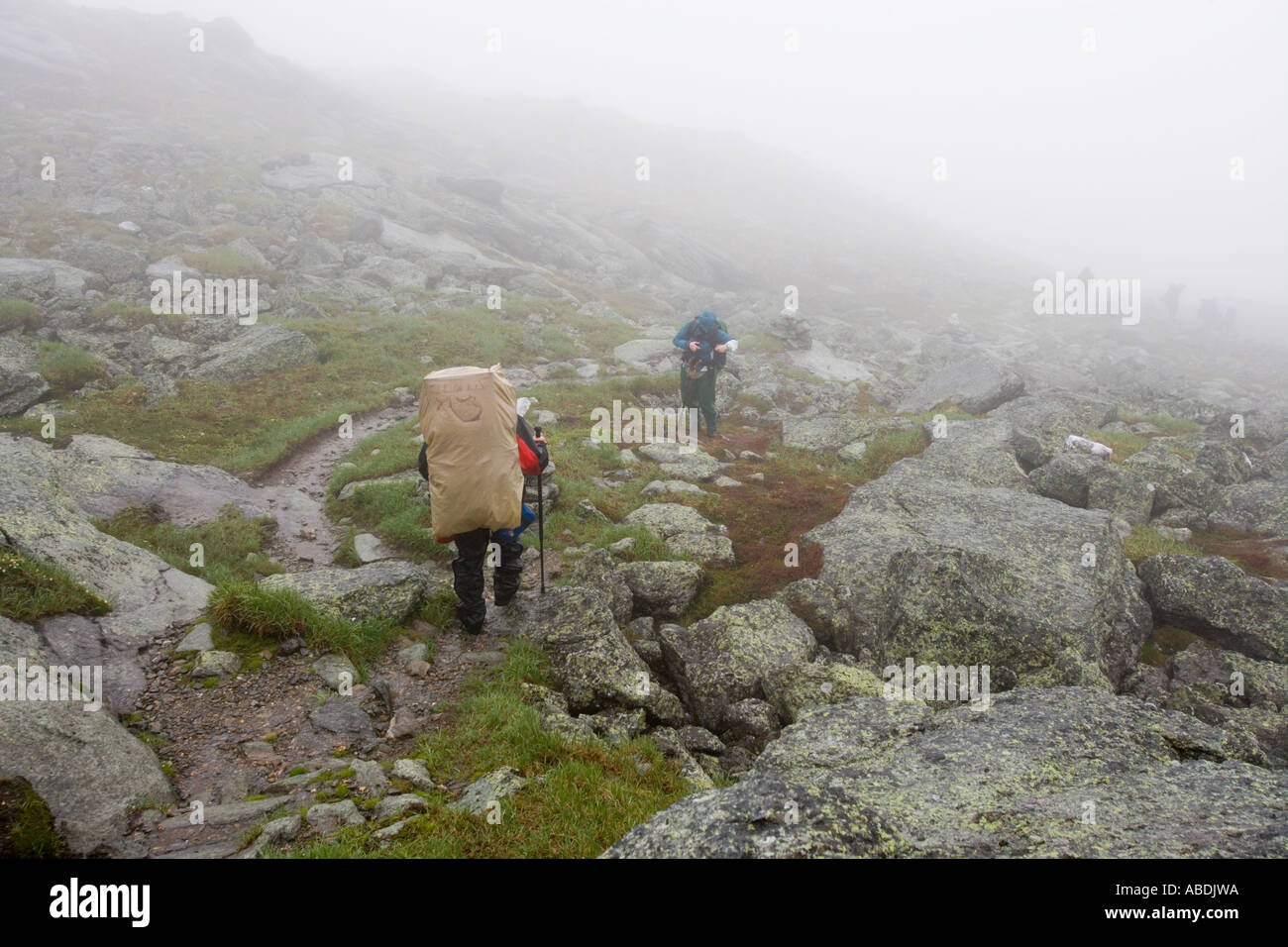 Hikers in the rain on Mount Washington in New Hampshire s White Mountains Stock Photo