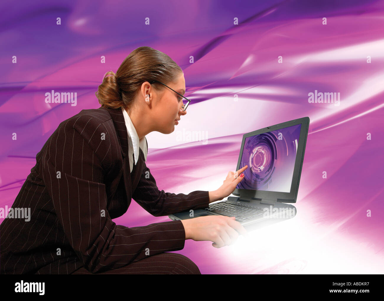 Woman picking on a screen of a laptop computer in a virtual world Stock Photo Alamy