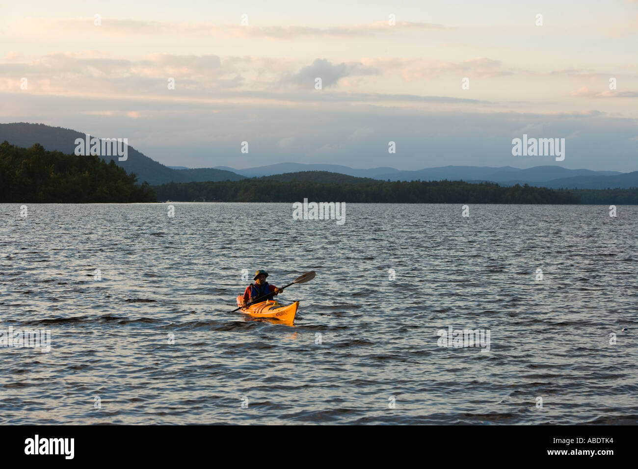 A paddler kayaking on Umbagog Lake near the Umbagog Lake State