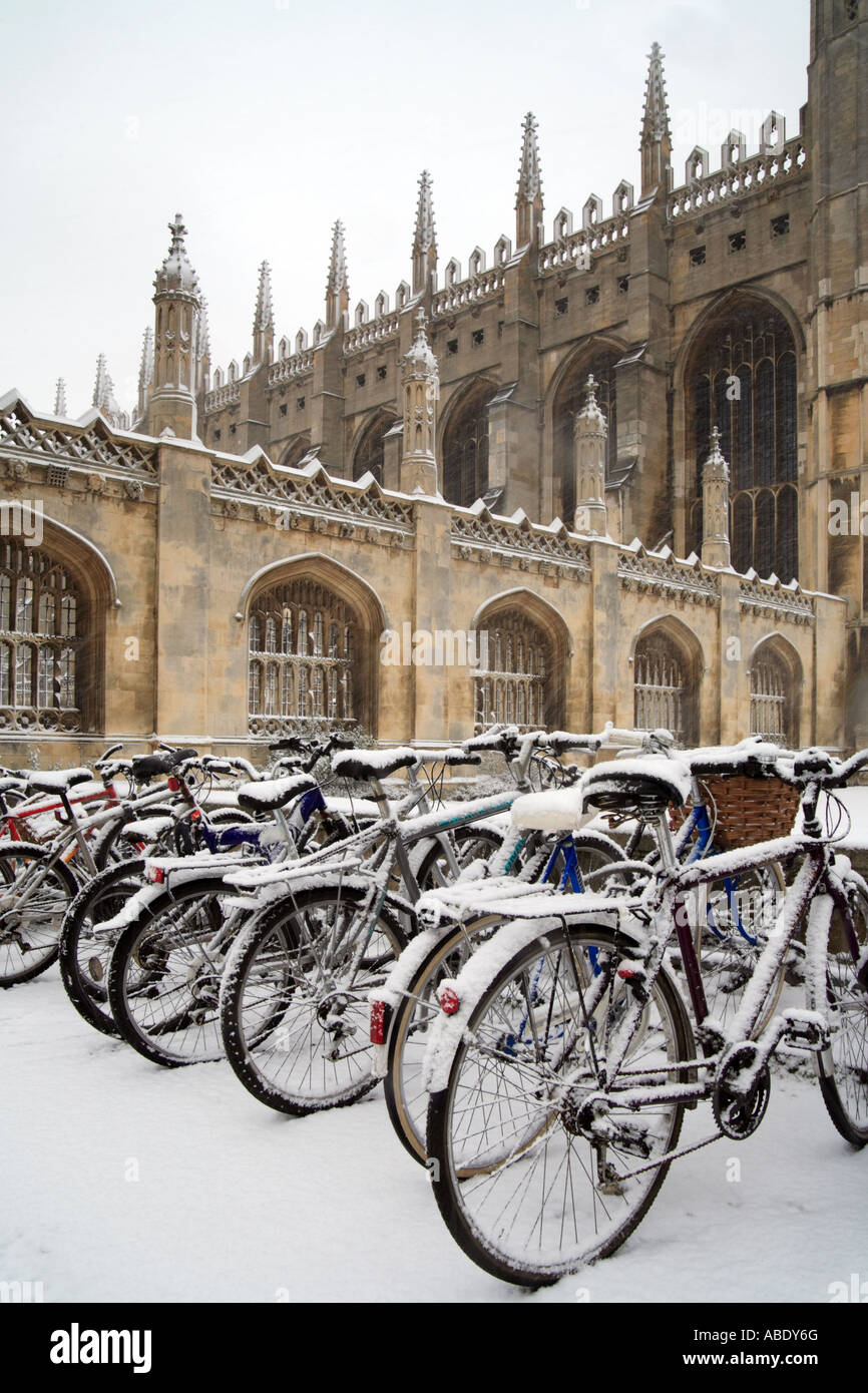 'Kings College'. Bicycles outside Kings College in the snow, with the college chapel in the background. Stock Photo