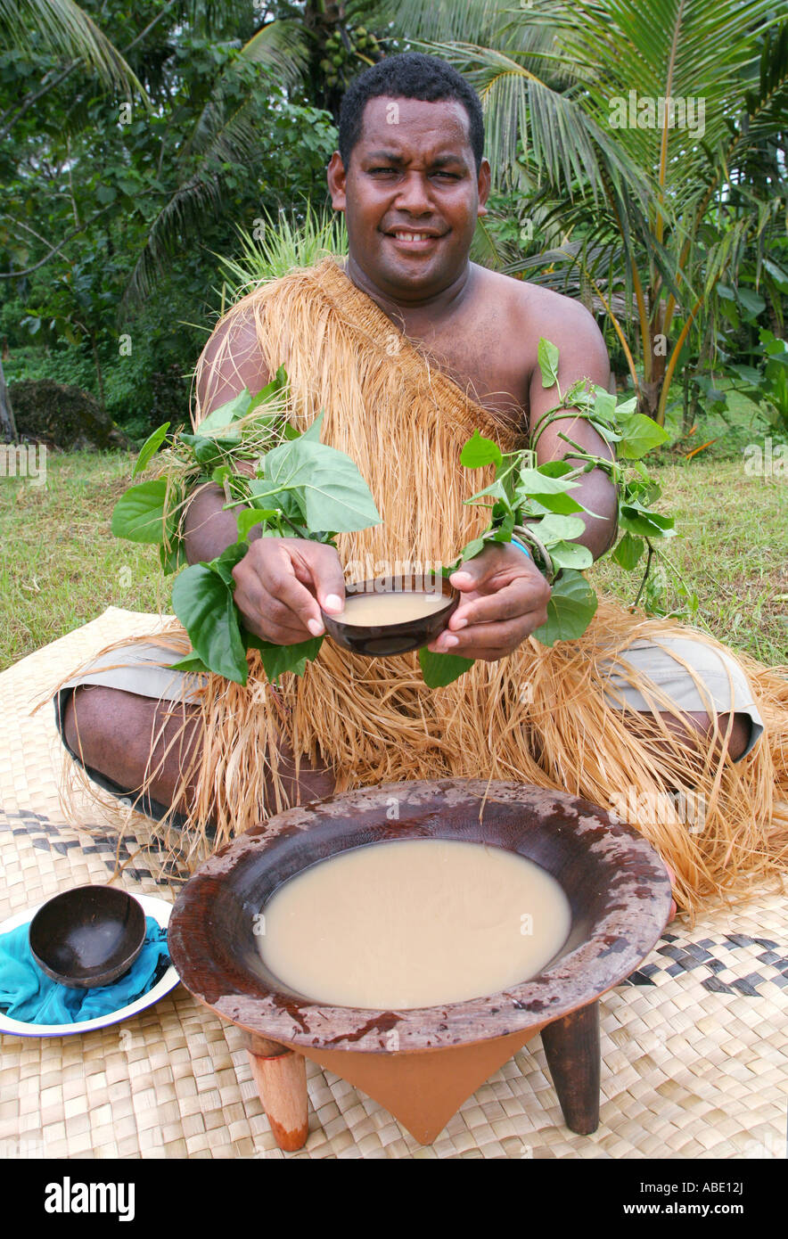 Solomon Islands, Kava drink (Piper methysticum) is passed in a coconut bowl by a melanesian inhabitant of the Solomon Islands Stock Photo