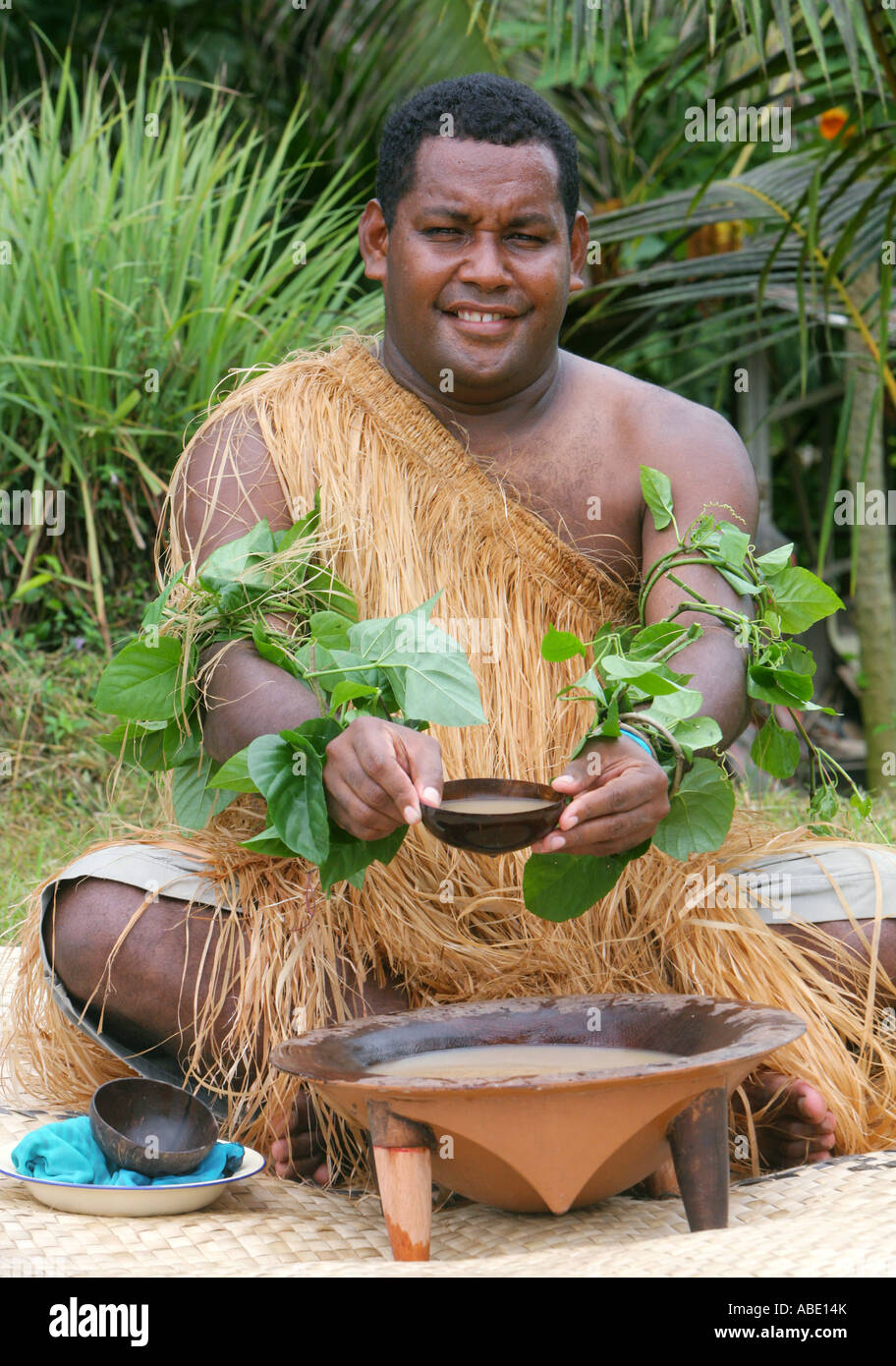 Solomon Islands, Kava drink (Piper methysticum) is passed in a coconut bowl by a melanesian inhabitant of the Solomon Islands Stock Photo
