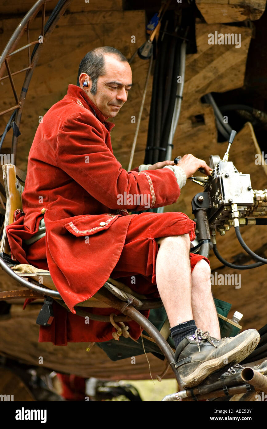 Puppeteer operating the hydraulics of the giant elephant puppet in the