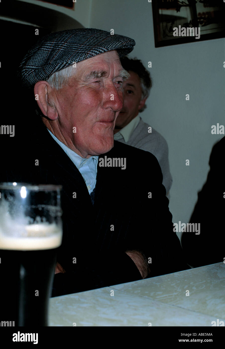 local west kerry man sits with a smile and drinking the black stuff Stock Photo