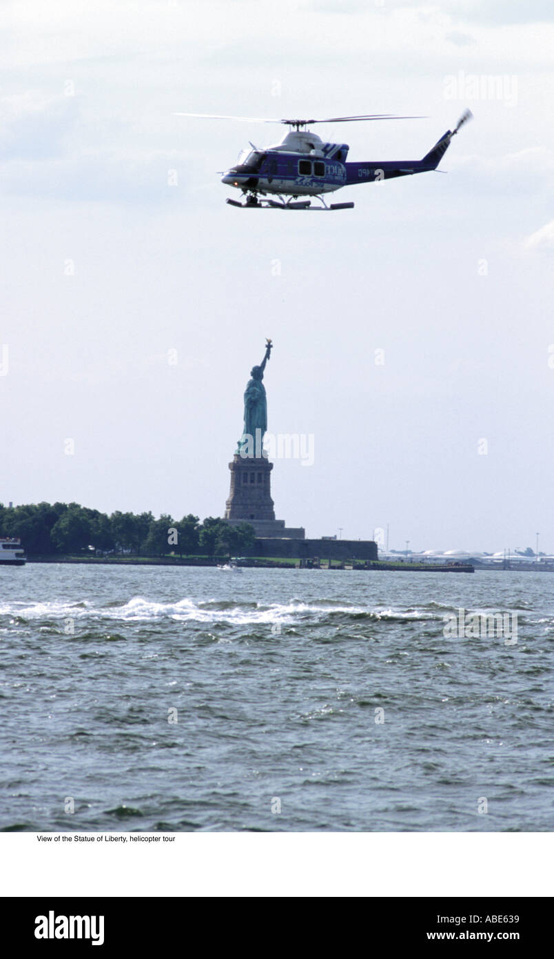 Helicopter flying over the statue of liberty Stock Photo Alamy