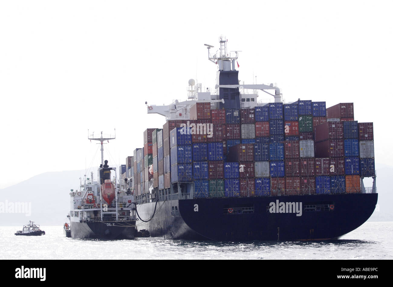 container ship with refueling boat Stock Photo Alamy