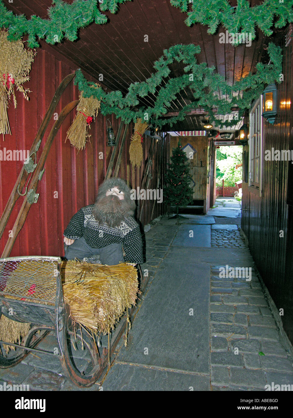 troll bogey gremlin kobold hobgoblin golblin sitting in skid sled in a passage of timber building in Trondheim in the old town Stock Photo