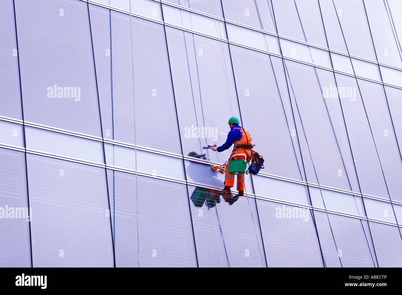 window cleaner suspended on wires at multistorey office block, Glasgow