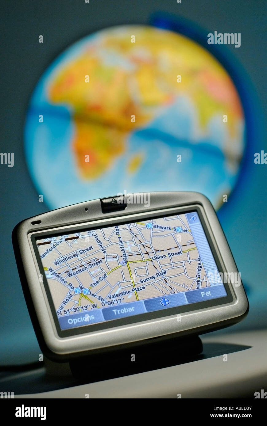 GPS SATELLITE NAVIGATION INSTRUMENT IN FRONT OF GLOBE Stock Photo Alamy