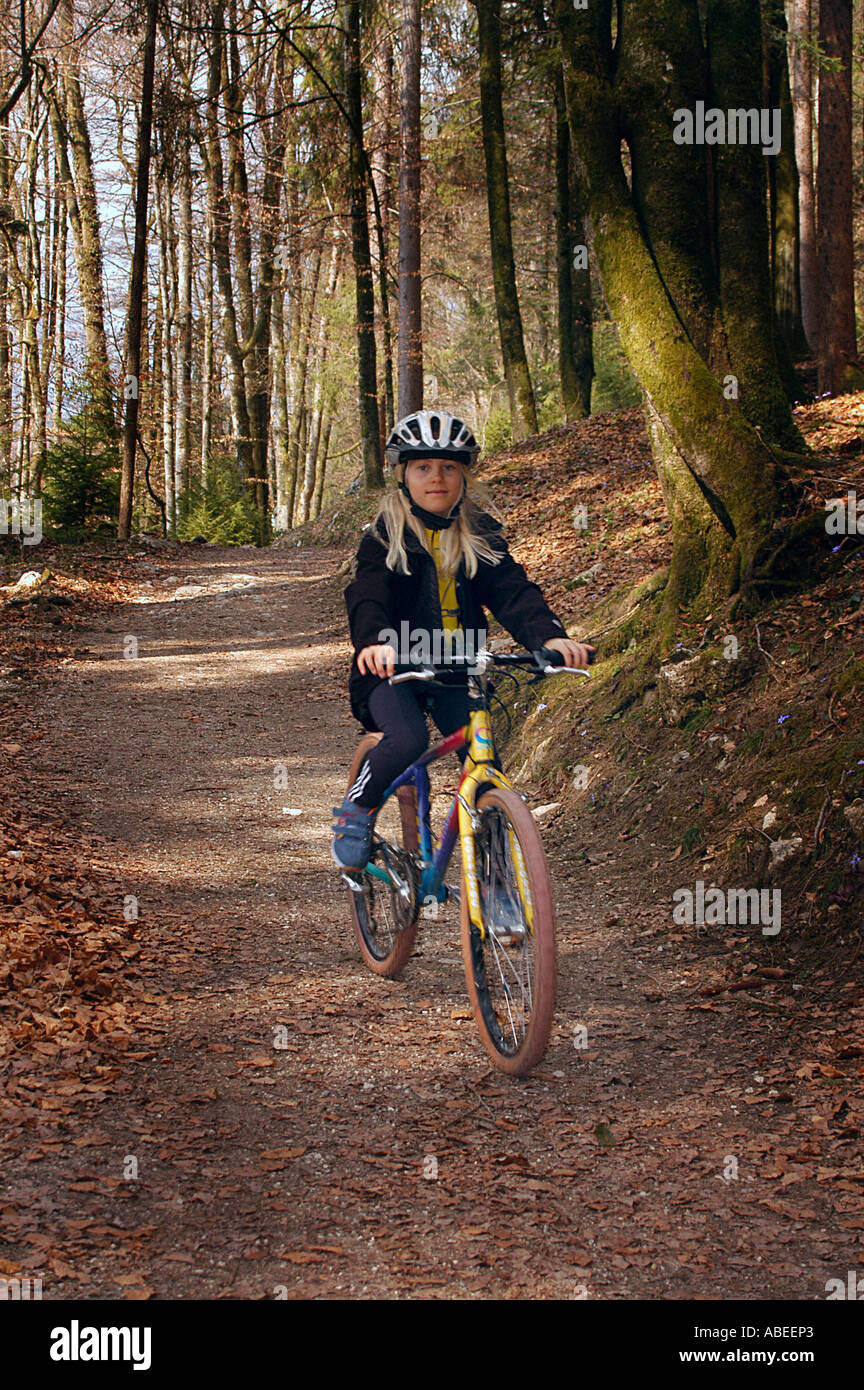 Child with Mountainbike and crash helmets Stock Photo Alamy