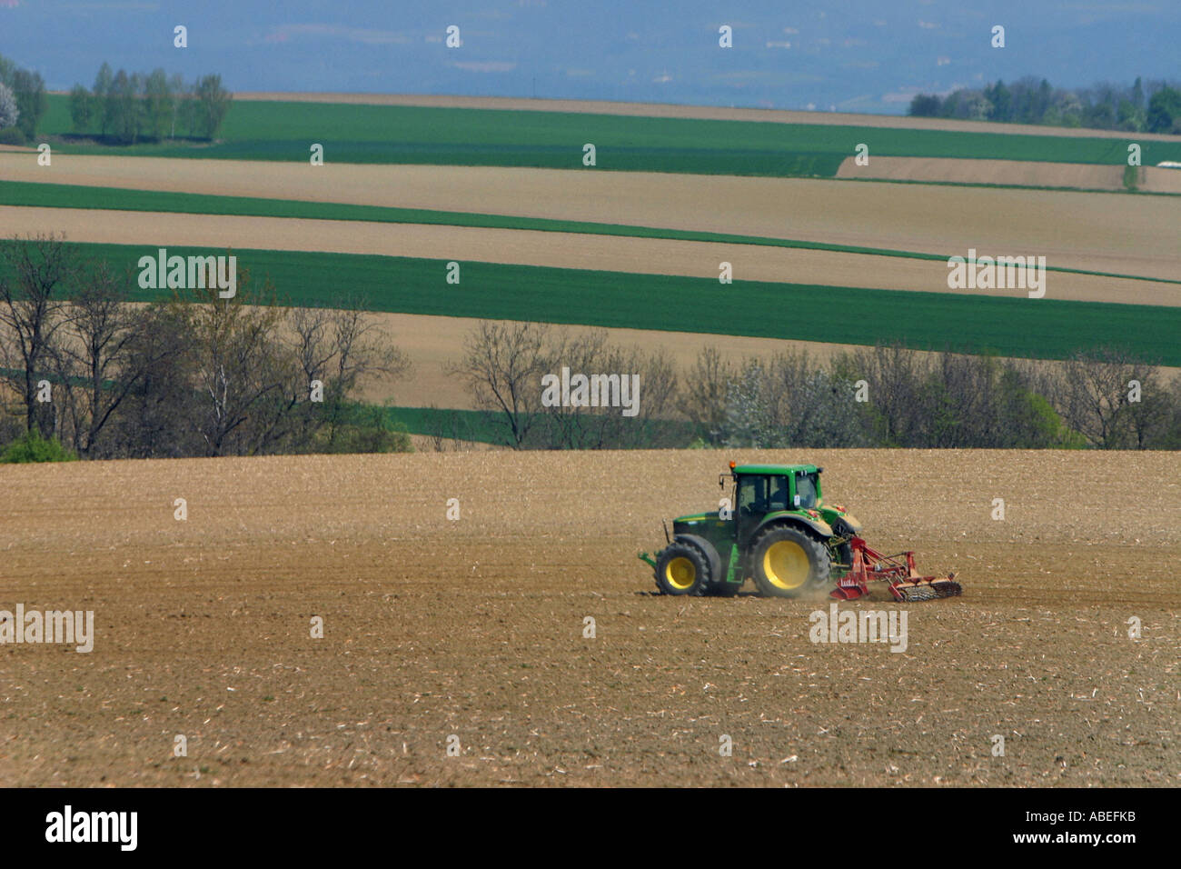 Tractor on a field Stock Photo - Alamy