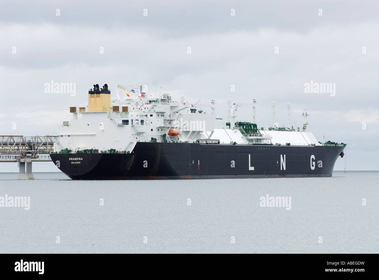 LNG tanker Granosa moored at jetty beside LNG Export terminal at Prigorodnoye  south Sakhalin Island Russia July 2007 Stock Photo