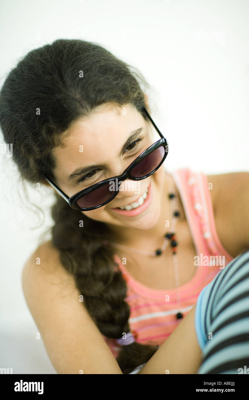 Preteen girl wearing sunglasses, smiling, portrait Stock Photo