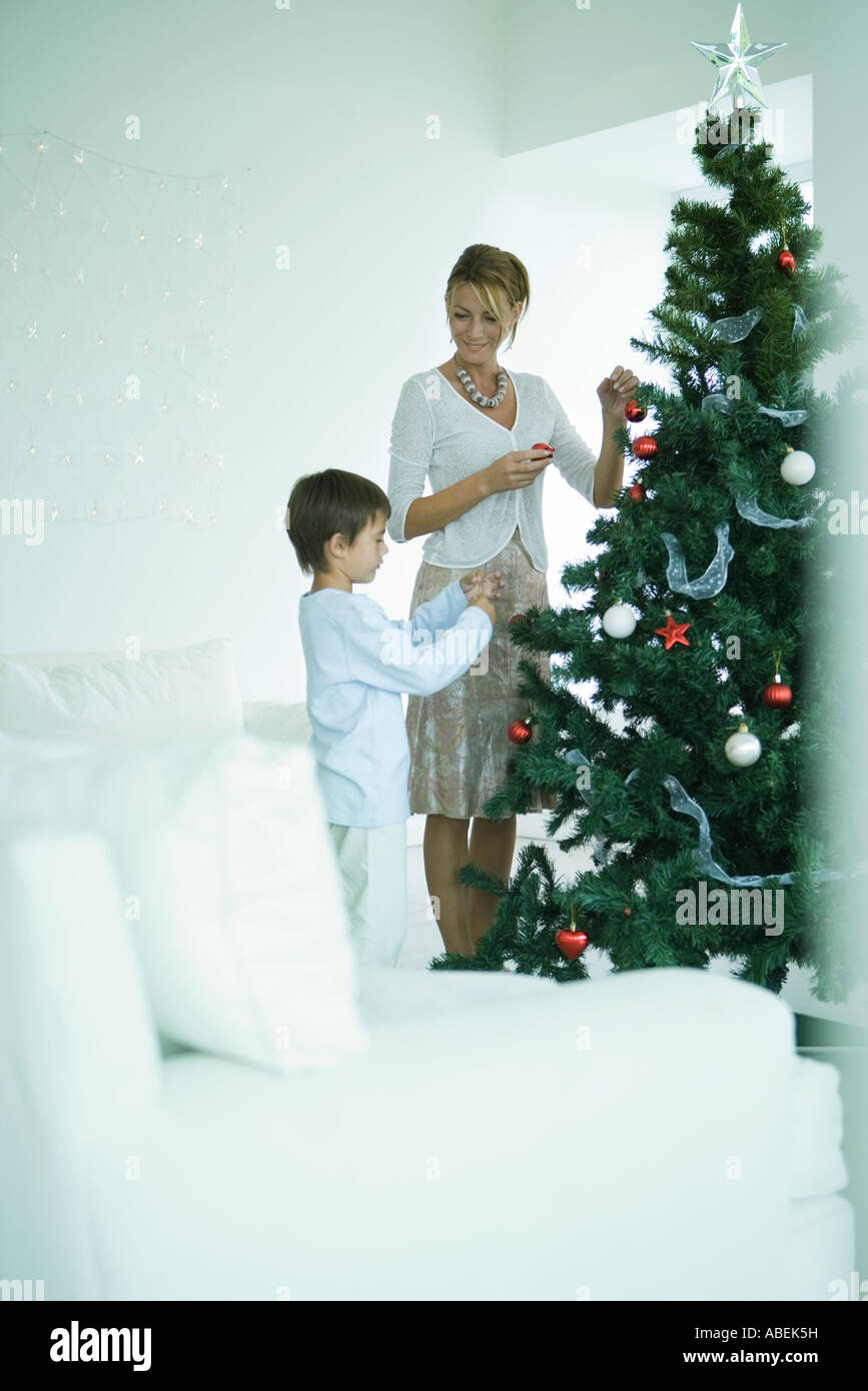 Mother and son decorating Christmas tree Stock Photo - Alamy
