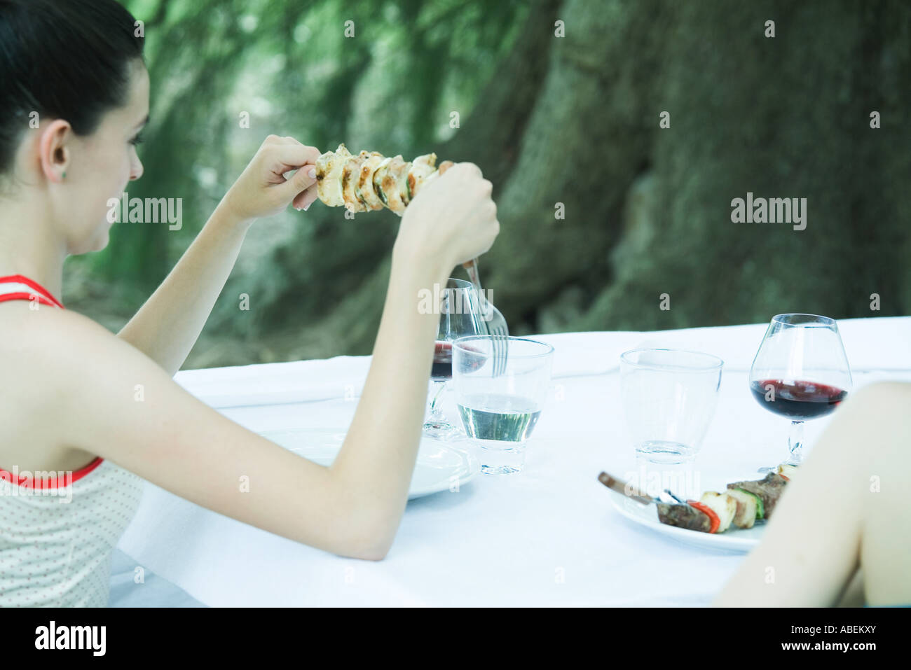 Teen girl holding kebab during cookout Stock Photo