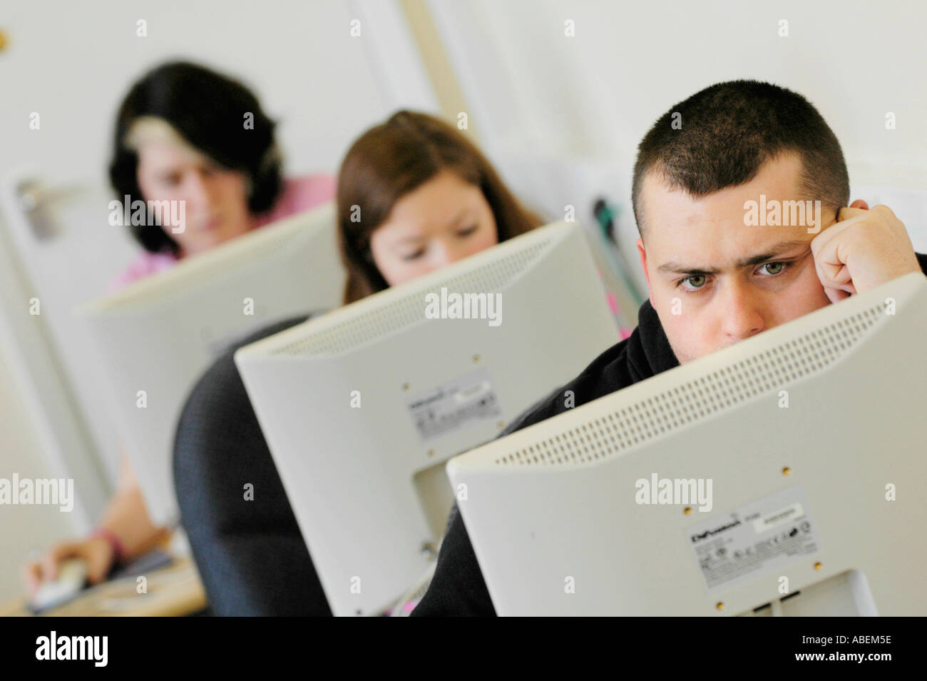 Cardiff University students studying for exams doing online research in the university library Cardiff South Wales UK Stock Photo