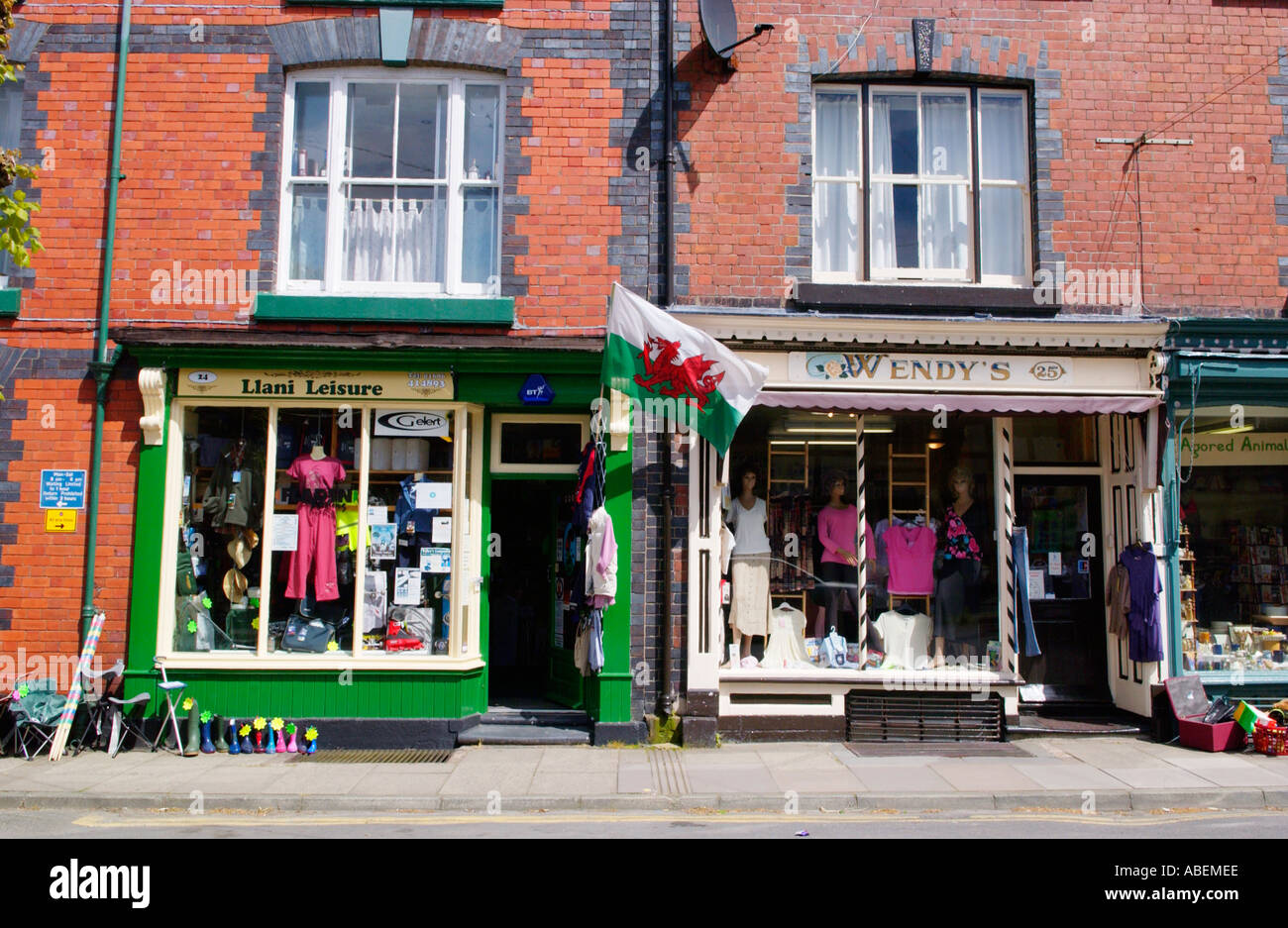 Local shops on high street in Llanidloes Powys Mid Wales UK Stock Photo