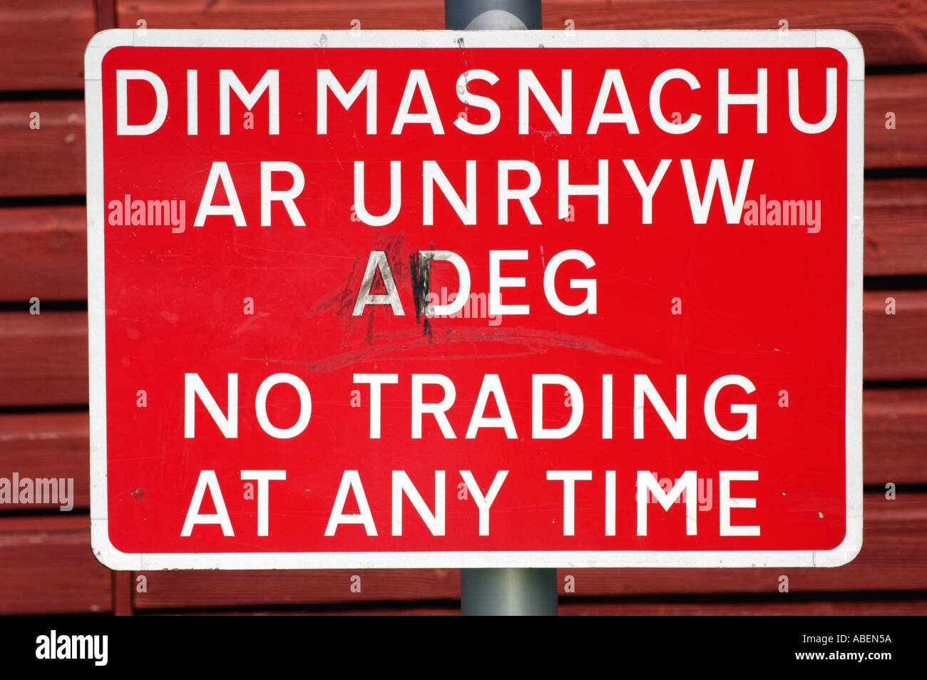 Red NO TRADING AT ANY TIME sign in cark park at Llanidloes Powys Mid