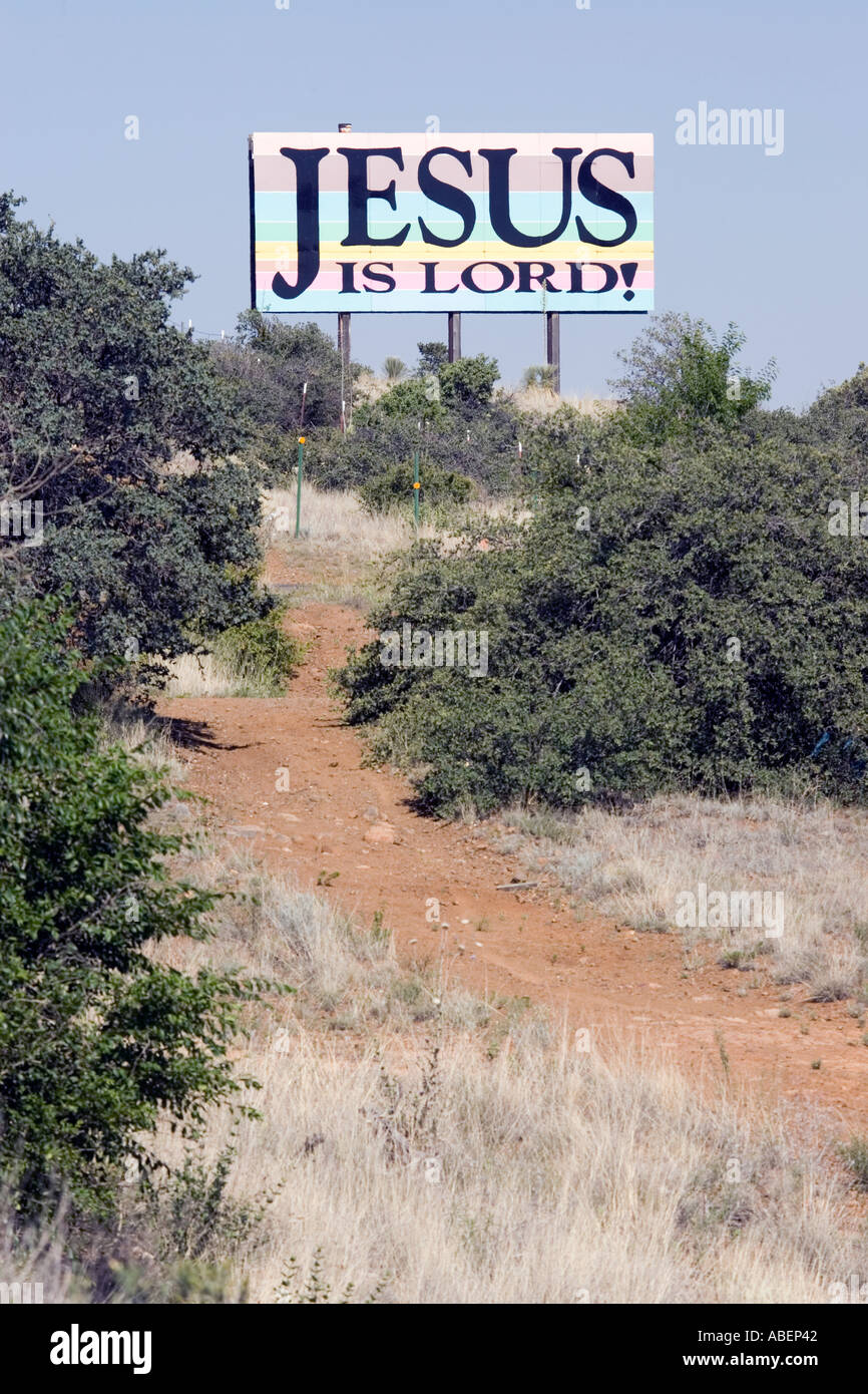 A billboard displaying a christian religious slogan in the countryside