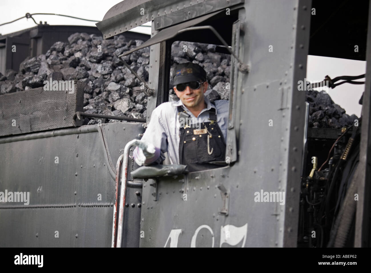 Engineer in a locomotive of the Cumbres an Toltec Scenic Railroad which operates in New Mexico and Colorado Stock Photo