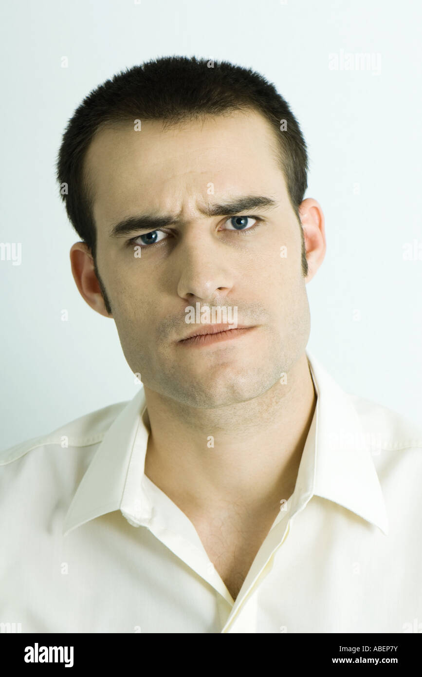 Man furrowing brow, portrait Stock Photo - Alamy