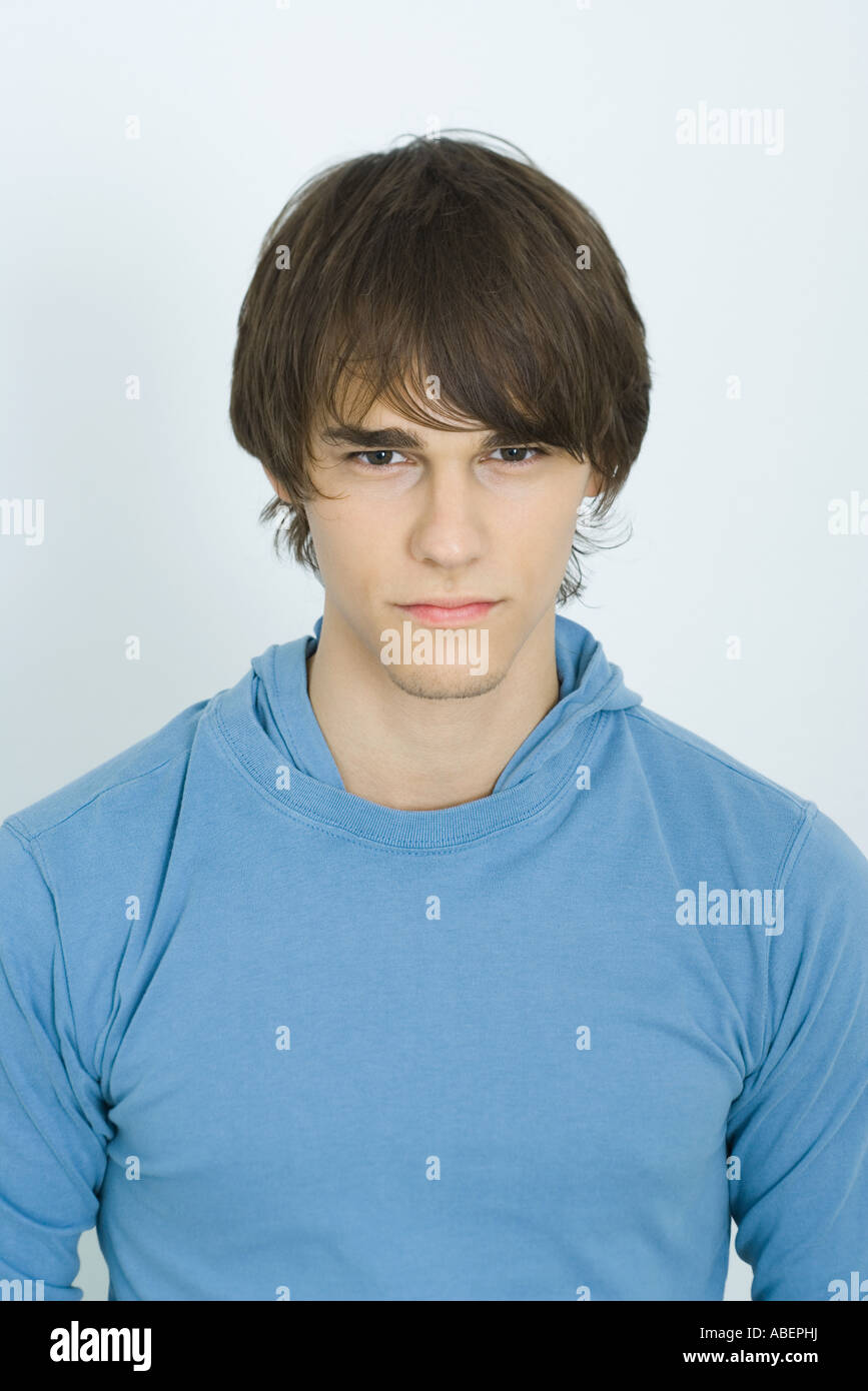 Young man looking at camera, portrait Stock Photo - Alamy