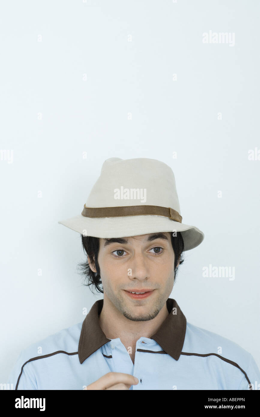 Young man wearing hat, looking away Stock Photo